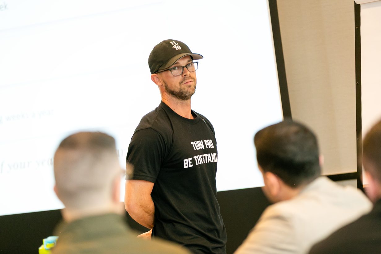 Daniel Woodrum speaking on stage