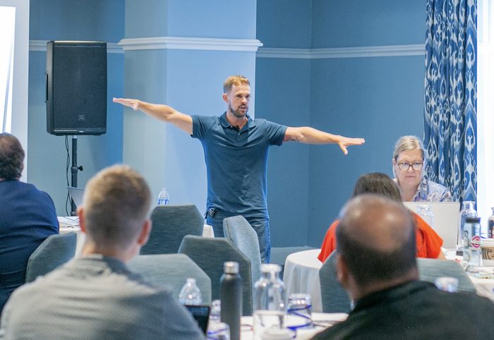 Daniel Woodrum speaking on stage